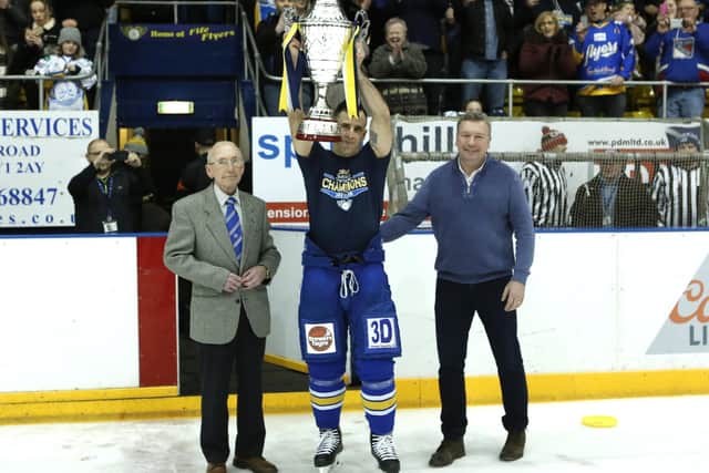 Jack Dryburgh and long-time friend and former Fife star Danny Brown make the presentation of the Gardiner Conference Trophy to Fife Flyers captain Russ Moyer (Pic: Steve Gunn)