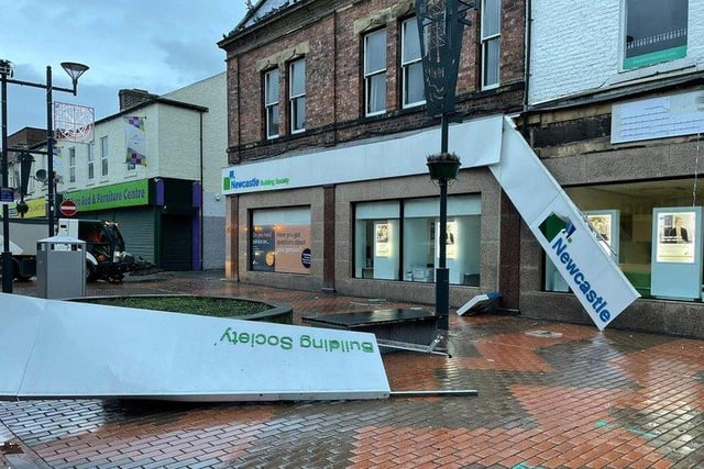Shop signage damaged by the wind in Sunderland city centre.