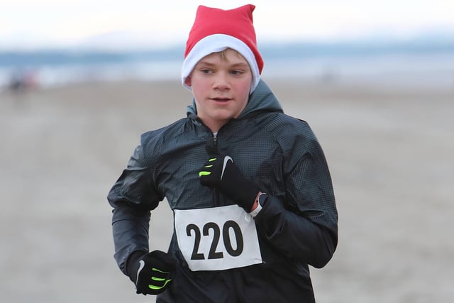 Luca Anderson was fourth back in 20:36 in Anster Haddies' Santa's Sleigh of Fire 5k beach race at St Andrews on Sunday