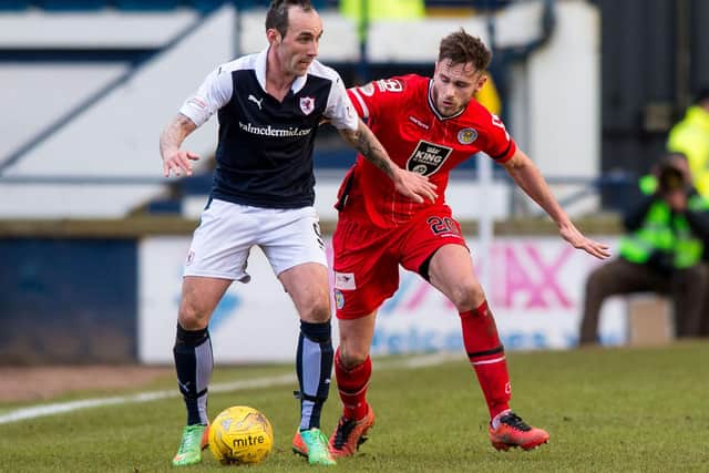 Raith Rovers' Mark Stewart holding off St Mirren's Keith Watson at Kirkcaldy's Stark's Park in March 2016 (Pic: Ross Parker/SNS Group)