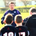 Chris Fusaro passes on some rugby hints and tips to Fife school pupils. Pic by Walter Neilson