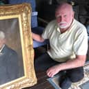 David Boyd Young with the portrait of his great-grandfather John Boyd.