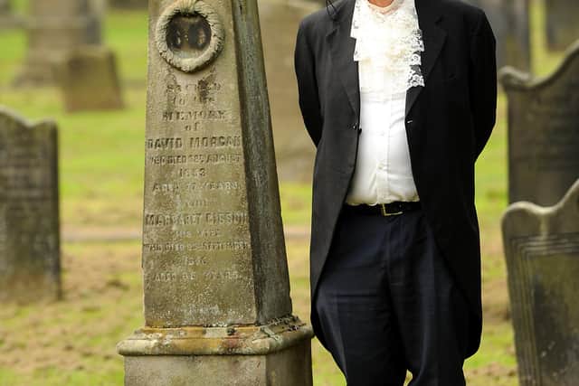 David Potter, who will be taking part in a re-enactment of the last duel in Scotland, standing by George Morgan's gravestone at the Old Kirk in Kirkcaldy. Pic: Fife Photo Agency