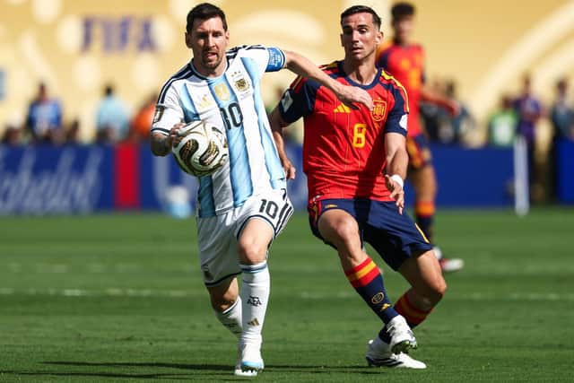 Lionel Messi playing for Argentina against Spain's Fabian Ruiz in this summer's World Cup final (Pic Franck Fife/Getty Images)