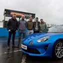 Raith Rovers players Zak Rudden, Scott McGill. Ross Matthews and Lewis Vaughan are picture beside an Alpine A110  and Touring Car star Gordon Shedden (Pic: submitted)