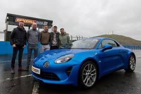 Raith Rovers players Zak Rudden, Scott McGill. Ross Matthews and Lewis Vaughan are picture beside an Alpine A110  and Touring Car star Gordon Shedden (Pic: submitted)