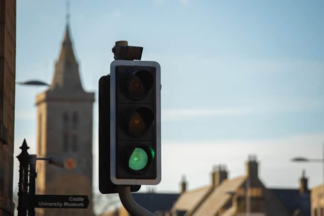 Traffic lights with St Salvator's Chapel-Tower in the background