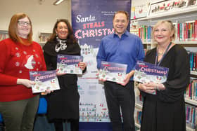 Eve Nairn-Magnante's dad Mark hands over copies of the book for Fife school libraries to, from left, Councillor Lesley Backhouse, Councillor Julie MacDougall and Burntisland Primary's headteacher Julie Anderson.  (Pic: submitted)