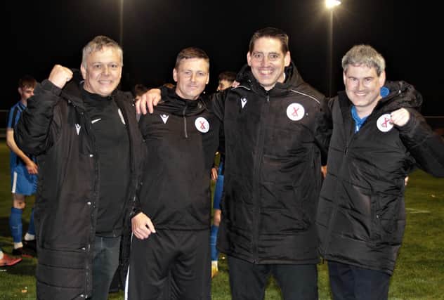 Robbie Raeside (second right) and his backroom staff celebrate last season's promotion (Pic by John Stevenson)