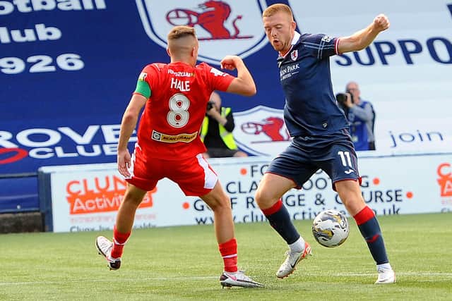 Raith Rovers' Callum Smith going up against Cliftonville's Rory Hale at home on Saturday in the third round of the SPFL Trust Trophy (Pic: Fife Photo Agency)