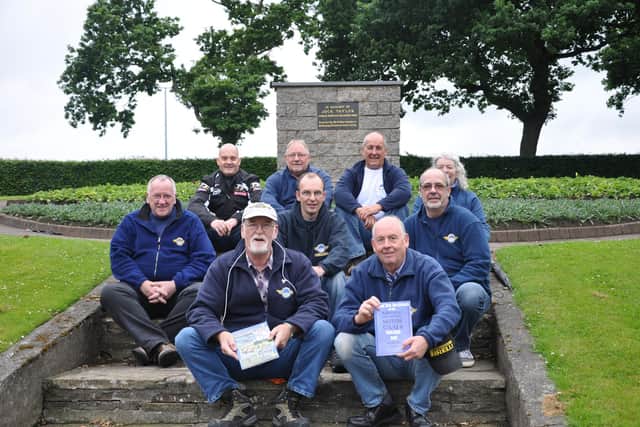 Jake Drummond pictured with other members of Kirkcaldy and District Motor Club in 2016 with their archive publications at the memorial in Beveridge Park Kirkcaldy.