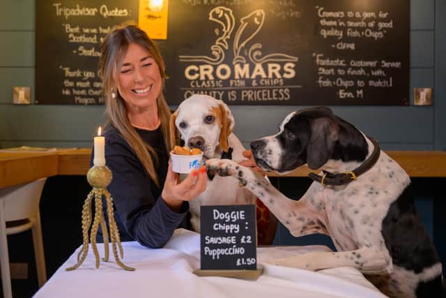 Cromars fish & chip shop in St Andrews launching their doggy-friendly menu with owner Wendy Napthine-Frame   (Pic: sandy Young)