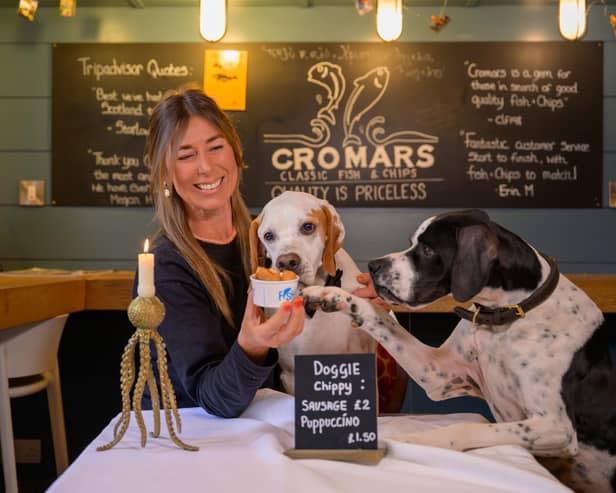 Cromars fish & chip shop in St Andrews launching their doggy-friendly menu with owner Wendy Napthine-Frame   (Pic: sandy Young)