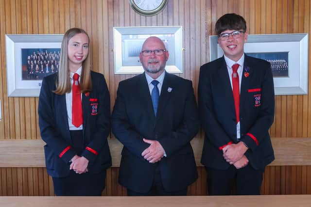 Rector Neil McNeil with pupils Anna Grieve and Lochlan Sweaton who will represent the school at a national service of thanksgiving with King Charles III, known as the Honours of Scotland ceremony. (Pic: Scott Louden)