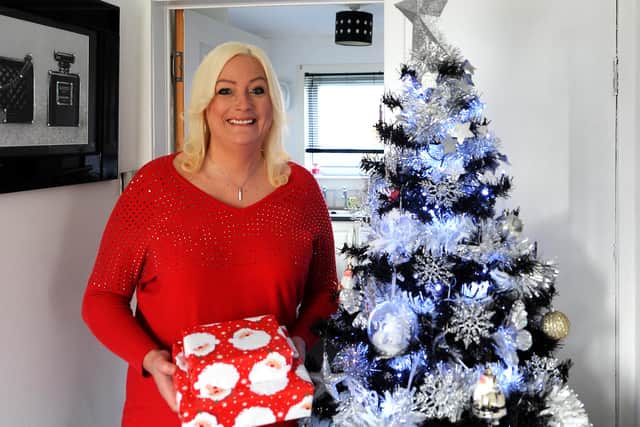 Pavola with her Christmas tree that has been up since last year. Pic: Fife Photo Agency.