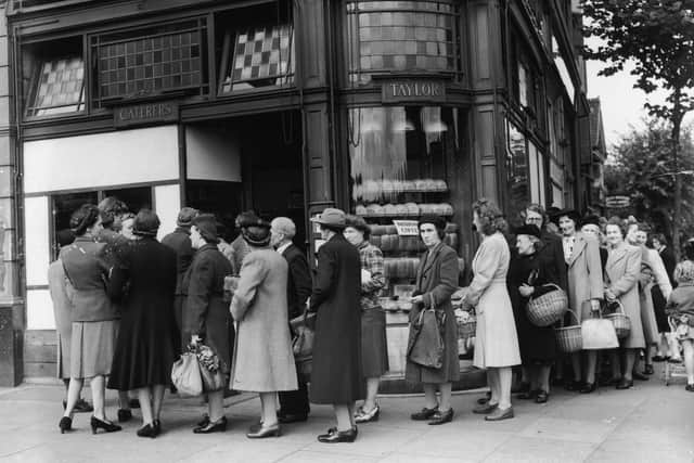 Queues forming outside a bakery on the last day before bread rationing is introduced.  (Pic: Douglas Miller/Keystone/Getty Images)