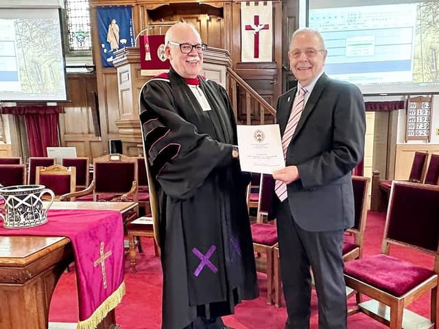 Ian Ogilvie receives his long service award from the Rev Graham Deans (Pic: Submitted)