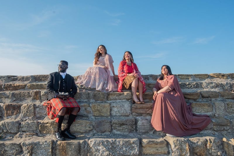 Patrick Obuobi from Ghana, Jannah Babar from Pakistan, Sherri Makhijani from Indonesia and Khrisha Patel from India dressed in national dress on the Pier on their graduation day, Tuesday 13 June 2023