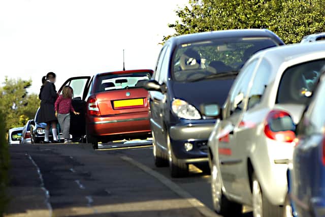 A typical scene as children are dropped off and picked up at schools across Fife