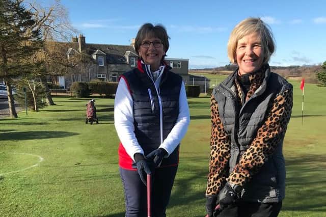 Captain Jan Stuart (left) and vice-captain Heather Fleming on their way to the first tee.