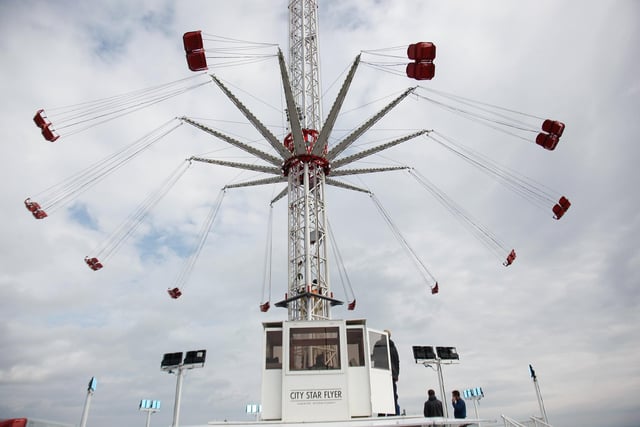 Feeling brave? This thrill seeking ride will carry you high about the street fair (Pic: Scott Louden)