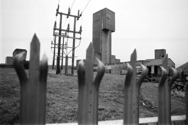 A view of the winding tower at Seafield colliery in Fife, seen through the spiked railings in 1988 (Pic: TSPL)