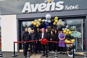 David Torrance cuts the red ribbon to formally open the new Avens store (Pic: Fife Free Press)