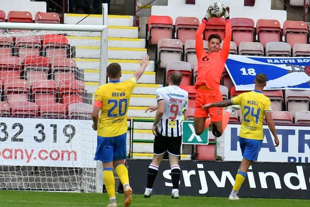 Rovers keeper Kevin Dabrowski leaps high to take possession