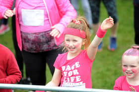 Young competitors warm up for the event's muddy 5k race