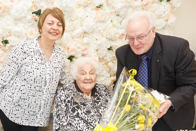 Dorothy Murray receives flowers from Councillor David MacDiarmid and Deputy Lieutenant Linda Bissett on her 100th birthday.  (Pic: Andrew Beveridge)