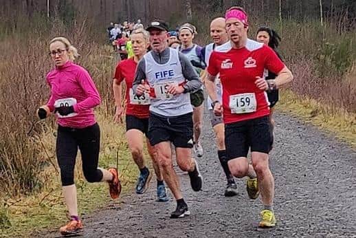 Andy Harley and Paul Harkins running in Devilla Forest during the Devilla 15k