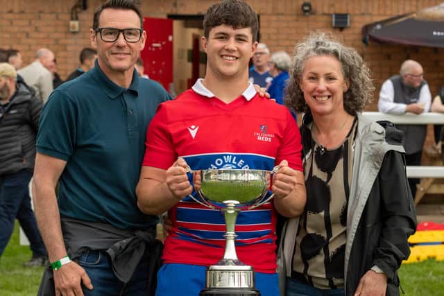 New Howe of Fife captain Fraser Allan celebrating with dad Adrian and mum Jennifer after helping Caledonia Reds win their first Scottish inter-district rugby championship since 2000 against South of Scotland at Braidholm in Glasgow on Sunday (Photo: Bryan Robertson)