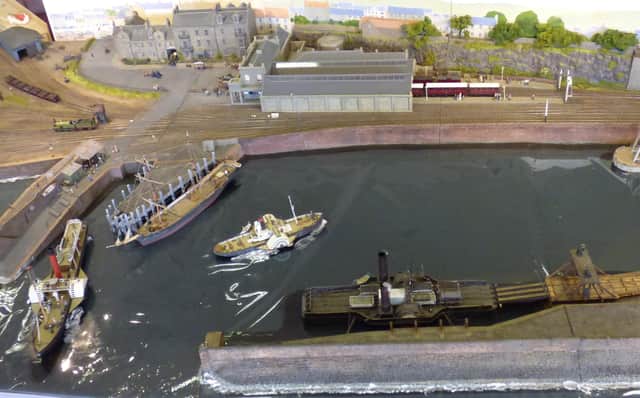 The detailed model layout shows how the harbour and station looked back in 1883.