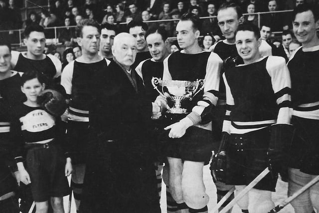 An early trophy presentation at Fife Flyers with 'Wee Smith' - Bert Smith - the mascot in the photo. Photo could date from 1938.