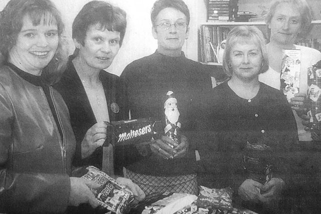 Scottish Slimmers from Kirkcaldy donated their Christmas selection boxes to Woman's Aid groups in Fife for struggling families at Christmas 2000. At the end of their campaign they had gathered 150.
