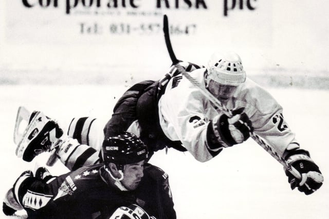 Flying through the air is this Flyer in a game versus Sheffield Steelers in 1992  (Pic: Bill Dickman/Fife Free Press)
