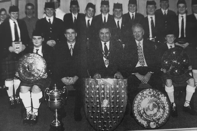 Lochgelly High School Pipe Band which won the 1987 Cowal Games and world championships, was honoured with a civic reception, hosted by Councillor John MacDougall.
Also pictured is Pipe Major, Tom Brown and school rector Brian Blanchflower.