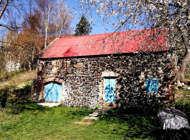 The old Hermitage building houses Art by the Loch.