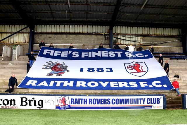 Members of Raith fans group Fife's Finest SC unfurl their new flag for the 2023/24 season at Stark's Park.  (Pic: Tony Fimister)