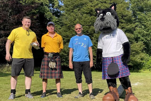 Dan Carlin, heavies competitor, Richard Cleary Ceres games president and charity director, Jim Parker managing director from Fife Properties and Hamish, the Scottish Building Society mascot