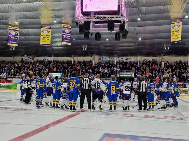 Fife Flyers and Glasgow Clan players and officials pay tribute to Adam Johnson before their game on Saturday (Pic: Fife Free Press)