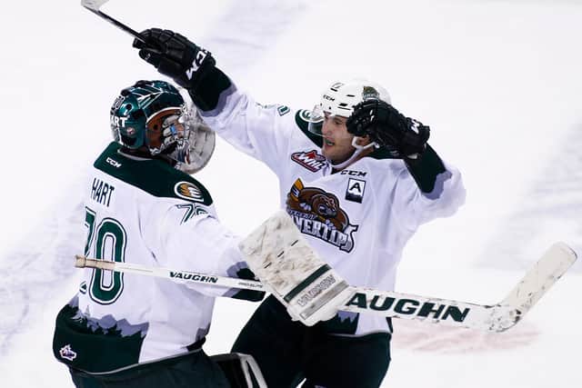 Carson Stadnyk of the Everett Silvertips celebrates his game winning goal against the Vancouver Giants with goaltender Carter Hart during overtime of their WHL game at the Pacific Coliseum on December 18, 2015 (Photo by Ben Nelms/Getty Images)
