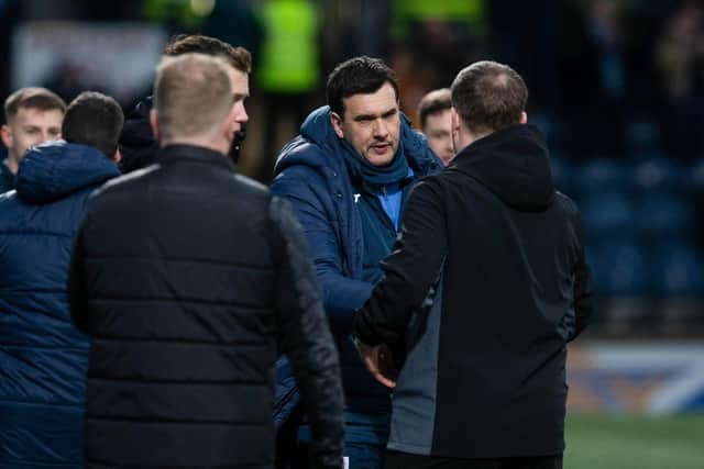 Raith boss Ian Murray commiserates with Steven Hammell after the Kirkcaldy side booked a trip to Ibrox by beating Motherwell. Hammell was sacked after the match. (Pic by Craig Foy/SNS Group)