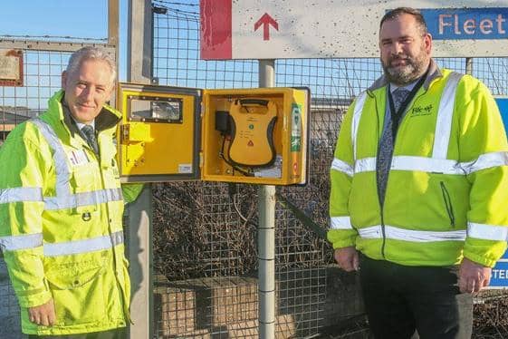 Roddy Sneddon (left) and Garry Hegg (right) With the new defibrillator.
