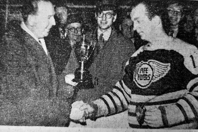 Fife Flyers netminder JAck ‘Stubby’ Mason received the Mirror of Merit trophy for season 1951-52.The presentation was made by Don Allison, Caledonian Cinemas publicity supervisor, and looking on in the centre is Victor Beattie, the popular match night announcer.