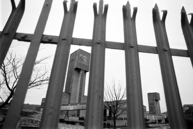 A view of the winding tower at Seafield colliery in Fife, seen through the spiked railings from 1988.