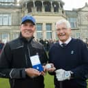 Ed Rankine, (left), successfully returned the ball to Peter Forster, the new captain of The Royal and Ancient Golf Club of St Andrews, at the traditional driving-in ceremony on the first tee of the Old Course. Pic Alan Richardson