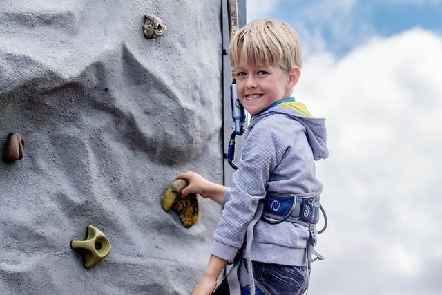 Tackling the climbing wall is 10-year old Harry Blacklock