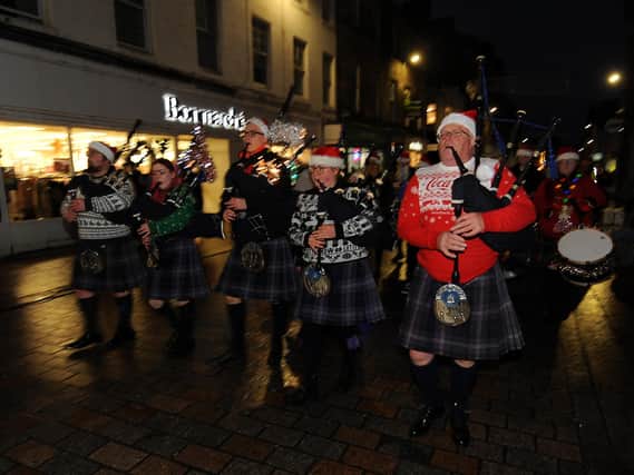 Members of Kirkcaldy and District Pipe Band in their festive jumpers led the lantern parade.