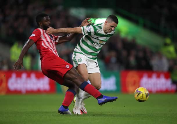 Blaise Riey-Snow vies with Tom Rogic. (Photo by Ian MacNicol/Getty Images)
